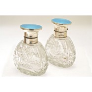 ANTIQUE SILVER AND ENAMELED PERFUME BOTTLES