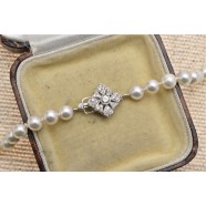 CULTURED PEARLS WITH WHITE GOLD DIAMOND SET CLASP